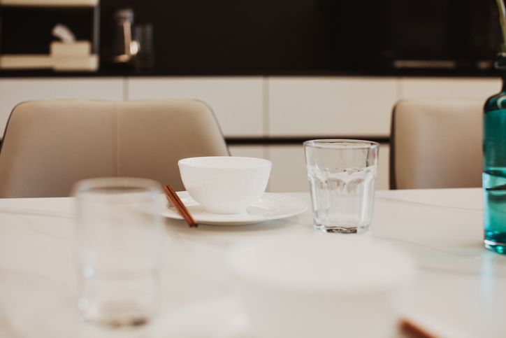A Glass of water on the dinning table.